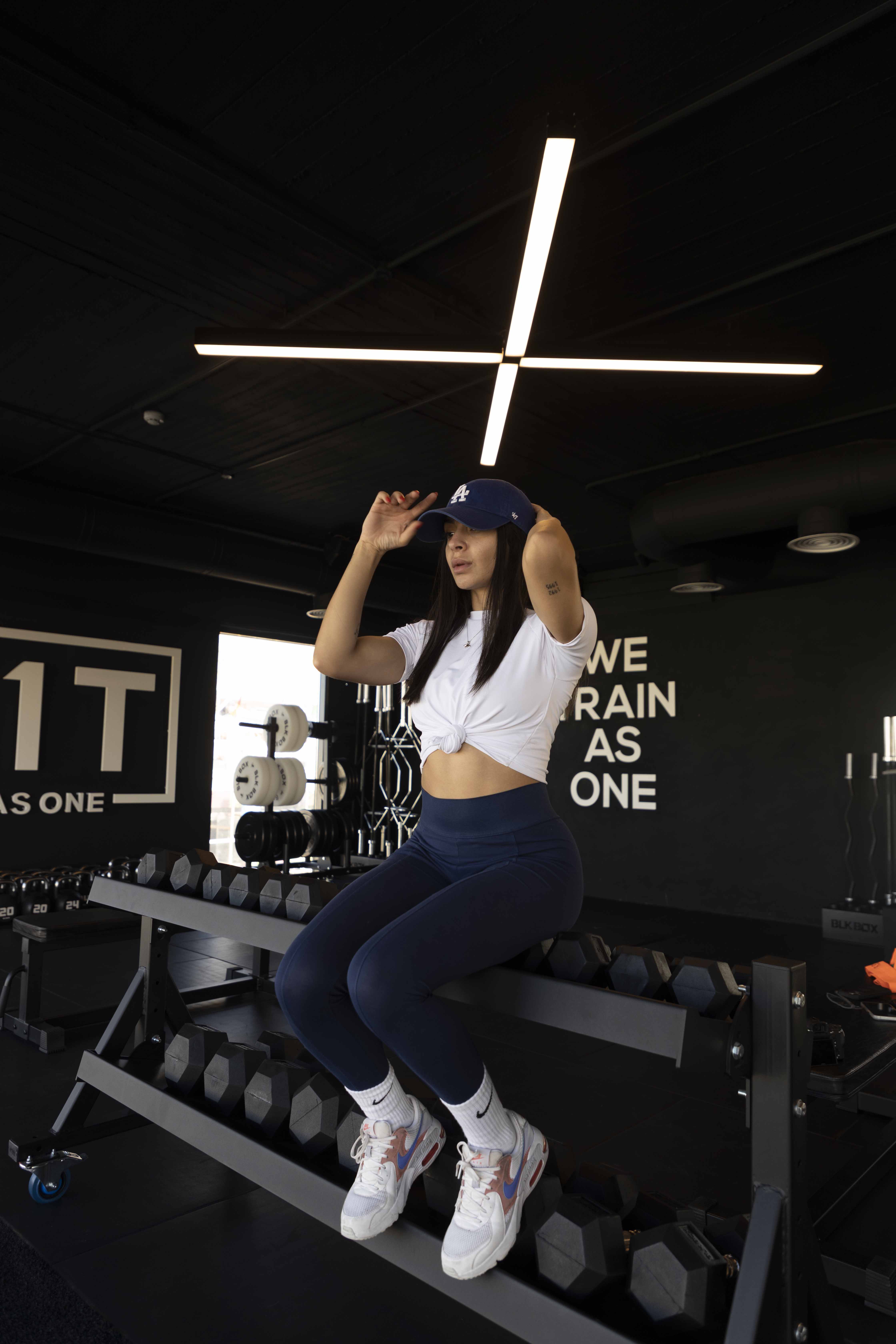 Maya seated in the gym